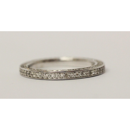 540 - Modern full diamond eternity ring, with further diamonds to the sides of the band, in 14ct white gol... 