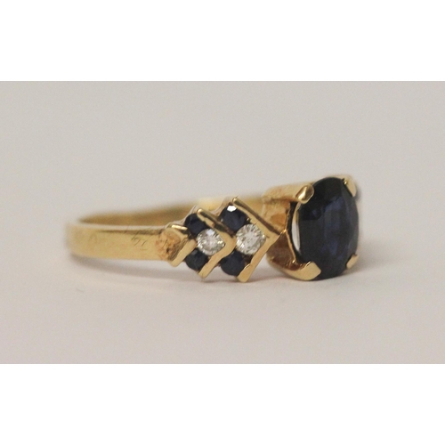 580 - 18ct gold sapphire and diamond dress ring, claw set central  sapphire on chevron design shoulders. S... 