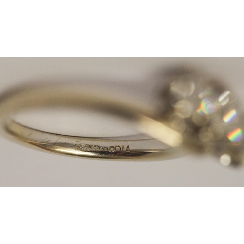 627 - A three stone diamond ring in cross over design setting, hallmarked 18ct white gold band. Ring size ... 