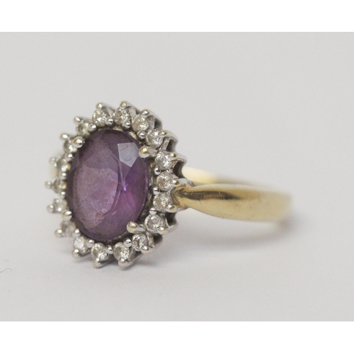 641 - An amethyst and diamond oval cluster ring, on 18ct yellow gold band, hallmarked, ring size N