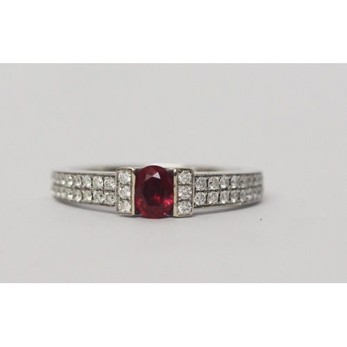 642 - A ruby and diamond band, in a modern setting with pave diamond shoulders, 18ct white gold, hallmarke... 