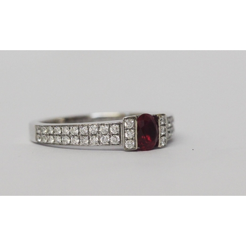 642 - A ruby and diamond band, in a modern setting with pave diamond shoulders, 18ct white gold, hallmarke... 