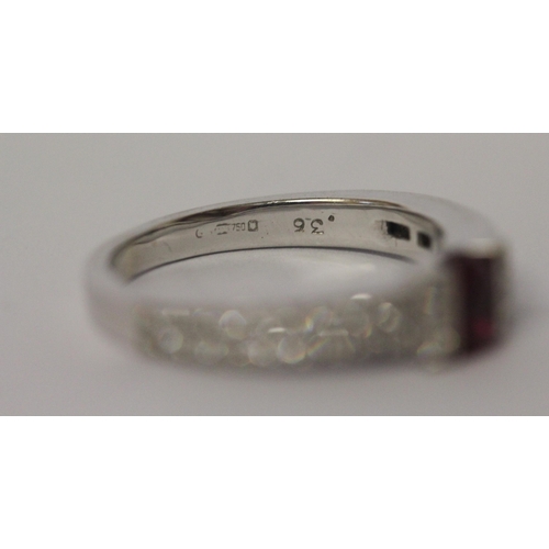 642 - A ruby and diamond band, in a modern setting with pave diamond shoulders, 18ct white gold, hallmarke... 