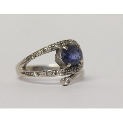 654 - A sapphire and diamond dress ring in 14ct white gold, Band marked 585, ring size M