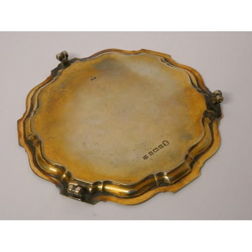 675 - A silver card waiter or small salver, with presentation inscription, Birmingham hallmarked 1933. Gro... 