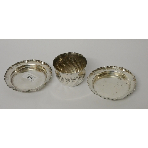 677 - A pair of silver frilled rim dishes and a sugar basin with half lobed detail. Gross weight 5.1 troy ... 