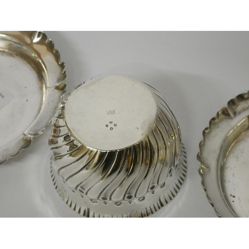 677 - A pair of silver frilled rim dishes and a sugar basin with half lobed detail. Gross weight 5.1 troy ... 