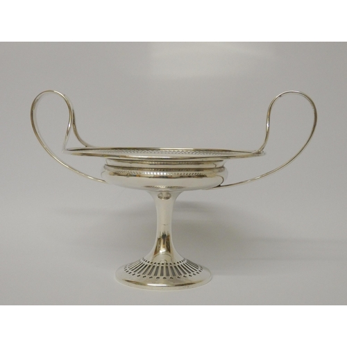 680 - A silver comport sweetmeat dish, with wide handles, pierced decoration. London 1909. Gross weight 9.... 