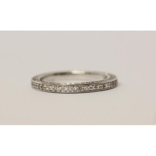 540 - Modern full diamond eternity ring, with further diamonds to the sides of the band, in 14ct white gol... 