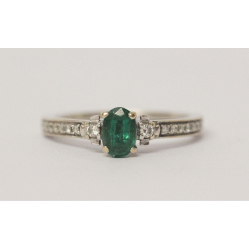 541 - Emerald and diamond engagement ring, in white gold, ring size K