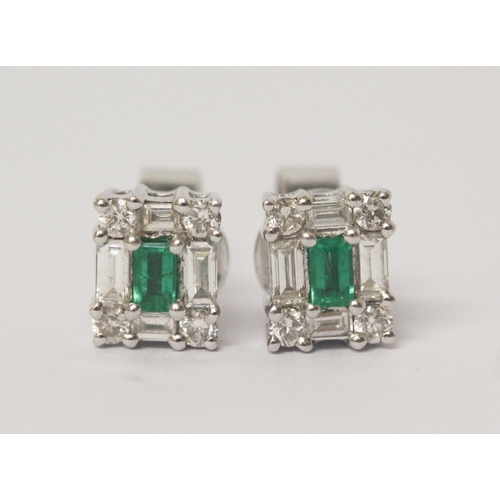 542 - Pair of emerald and baguette cut diamond ear studs, on 18ct white gold posts, hallmarked.