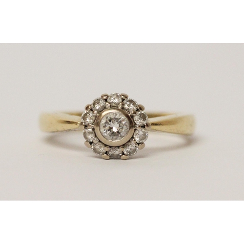 543 - A diamond circular cluster ring, in 18ct yellow gold, hallmarked, marked in shank 0.50 pts. Ring siz... 