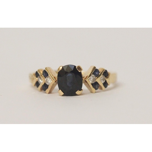 580 - 18ct gold sapphire and diamond dress ring, claw set central  sapphire on chevron design shoulders. S... 