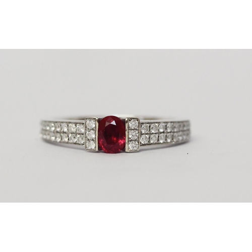 642 - A ruby and diamond band, in a modern setting with pave diamond shoulders, 18ct white gold, hallmarke... 