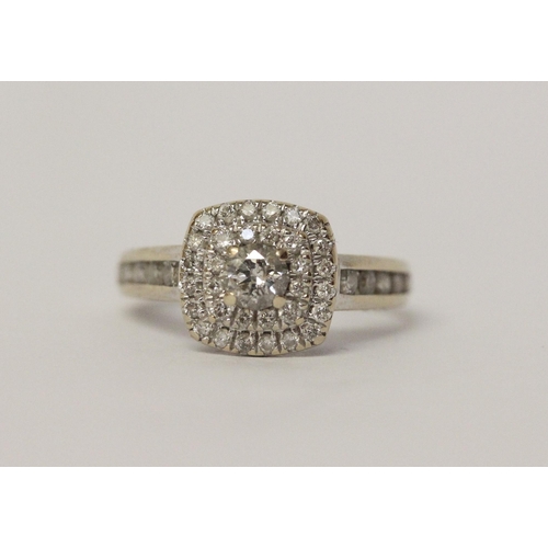 644 - A modern diamond halo cluster ring, diamond set shoulders, in hallmarked 18ct white gold, marked in ... 