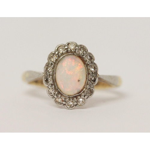 648 - Vintage opal and diamond oval cluster ring, shank marked 18ct & Plat. Ring size K