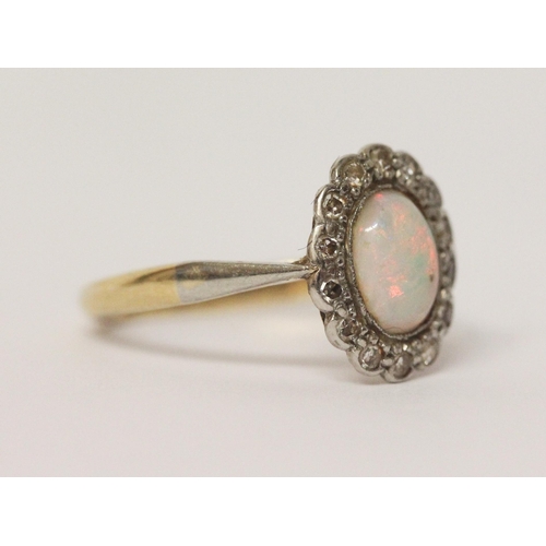 648 - Vintage opal and diamond oval cluster ring, shank marked 18ct & Plat. Ring size K