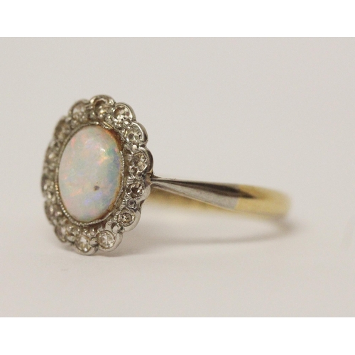 648 - Vintage opal and diamond oval cluster ring, shank marked 18ct & Plat. Ring size K