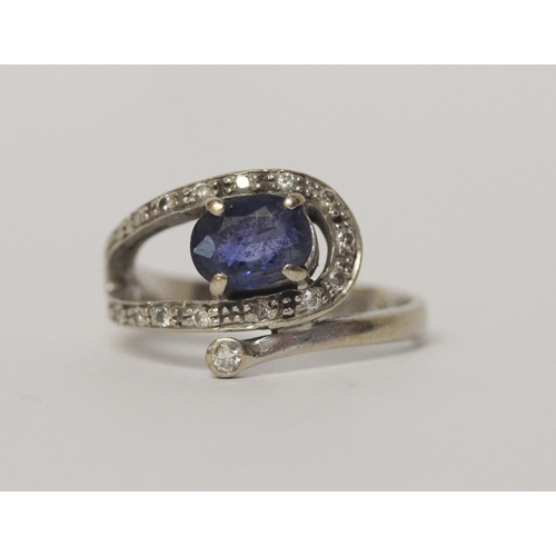 654 - A sapphire and diamond dress ring in 14ct white gold, Band marked 585, ring size M