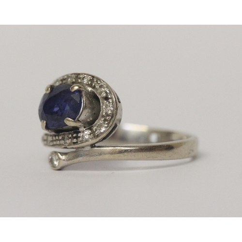 654 - A sapphire and diamond dress ring in 14ct white gold, Band marked 585, ring size M