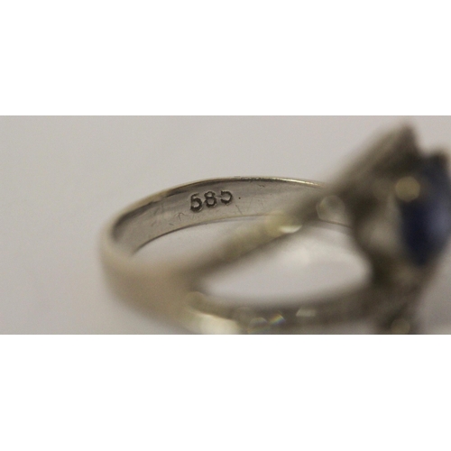 654 - A sapphire and diamond dress ring in 14ct white gold, Band marked 585, ring size M