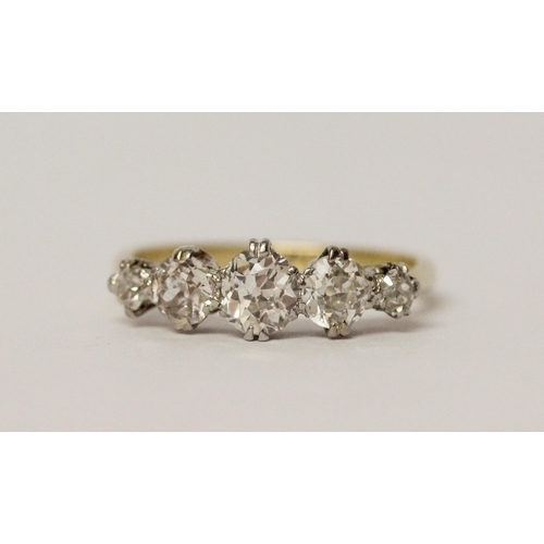 671 - A vintage five stone diamond ring, set with five graduated old brilliant cut diamonds, shank marked ... 