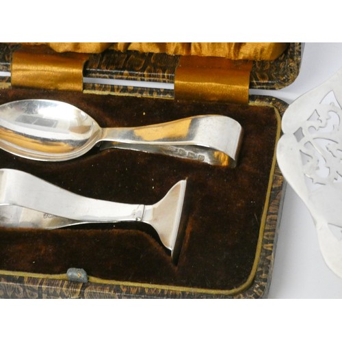 717 - An Australian silver dollar coin, a pierced hallmarked silver bon bon dish and a cased set of silver... 