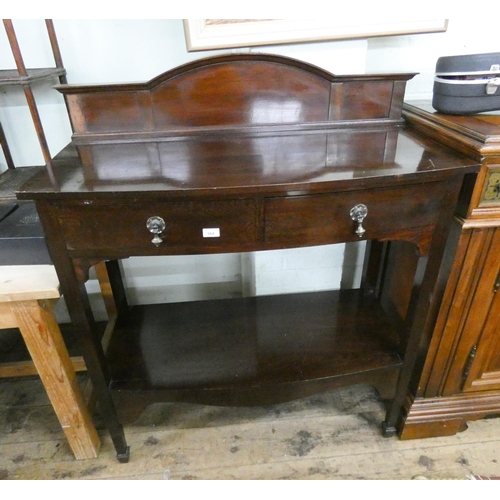 8 - A mahogany bow fronted two tier hall or serving table, fitted with two drawers, 3'6 wide