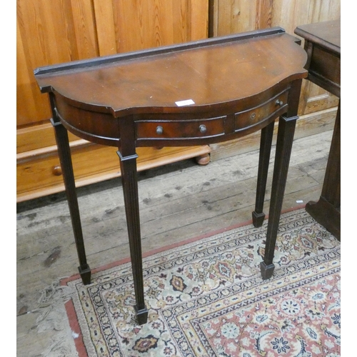 16 - A reproduction mahogany D-shaped console table fitted two drawers on reeded legs, 2'6 wide