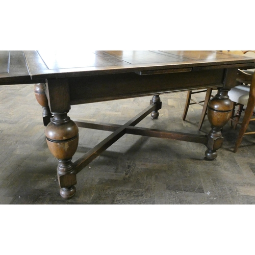 60 - An oak drawer leaf dining table on bulbous legs with cross stretchers, with leaves in it is 4'3 x 3'... 