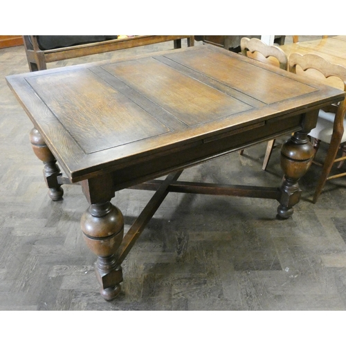 60 - An oak drawer leaf dining table on bulbous legs with cross stretchers, with leaves in it is 4'3 x 3'... 