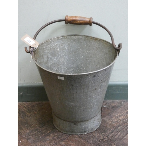 732 - A galvanised water pail with wooden handle