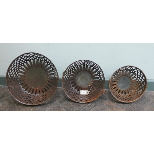 734 - Three steel lattice graduated bowls with ring handles