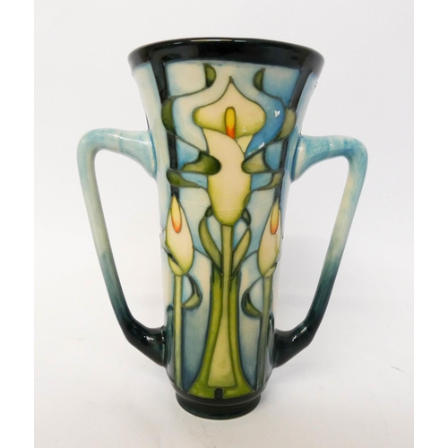 164 - A modern Moorcroft twin handled vase, decorated with Arum lilies, dated 2001 to the base, 15cms tall