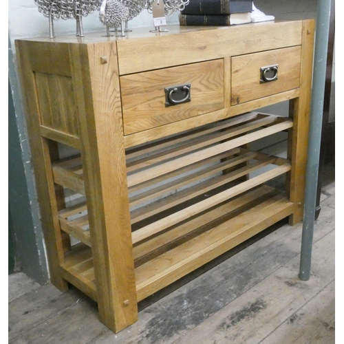 1 - A good quality light oak hall or side table fitted two drawers with under tiers, 37