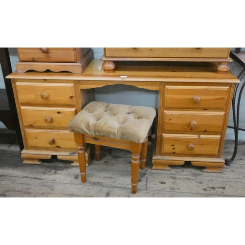 14 - A pine kneehole dressing table fitted three drawers with matching stool, 4'9 wide