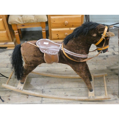 23 - A child's brown plush rocking horse