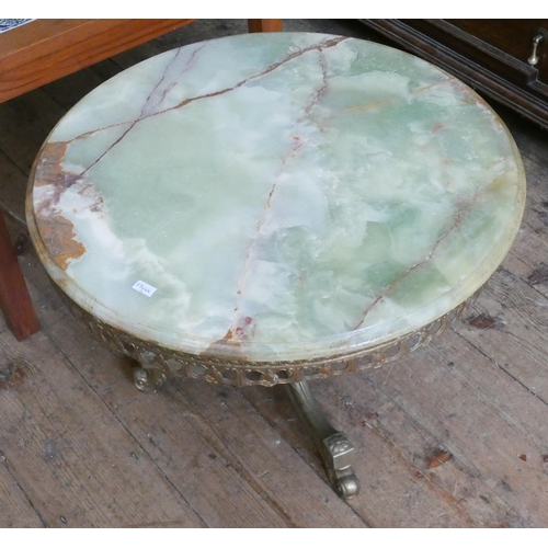 29 - A circular onyx topped coffee table on brass tripod base