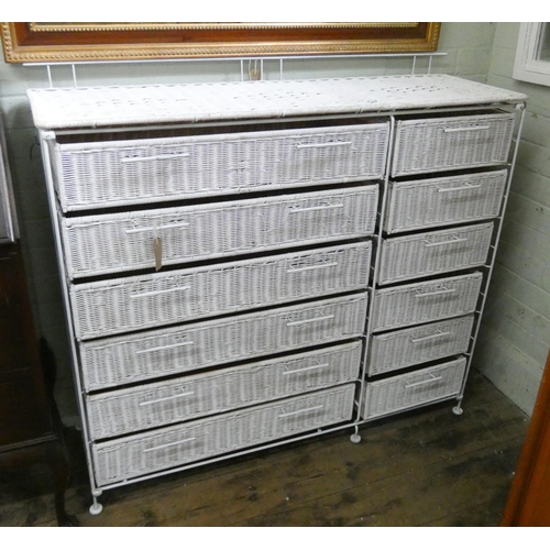 52 - A white painted metal framed wicker chest of six long and six short drawers