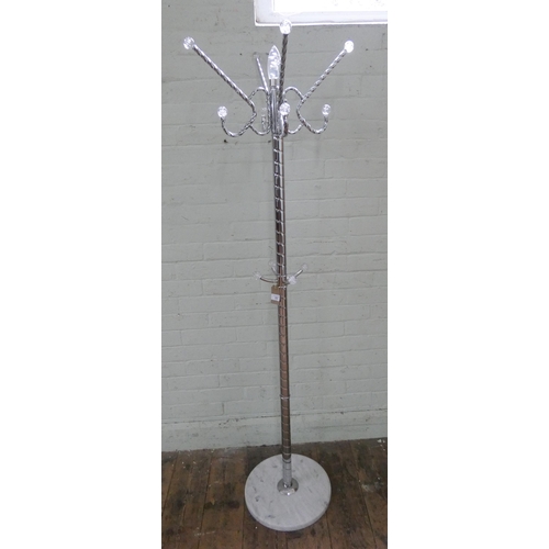 53 - A contemporary chrome hat and coat stand on a white marble base