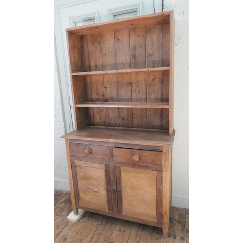 57 - A stripped and waxed pine kitchen dresser with drawer and cupboards under, 3'6 wide