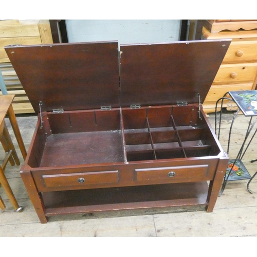 6 - A mahogany two tier coffee table with lift up storage compartments