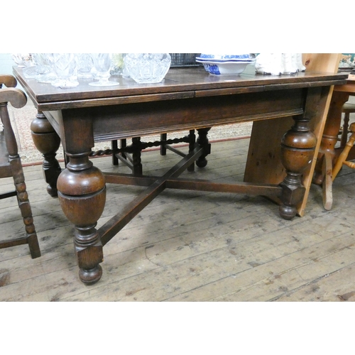 60 - An oak drawer leaf dining table on bulbous legs with cross stretchers, with leaves in it is 4'3 x 3'... 