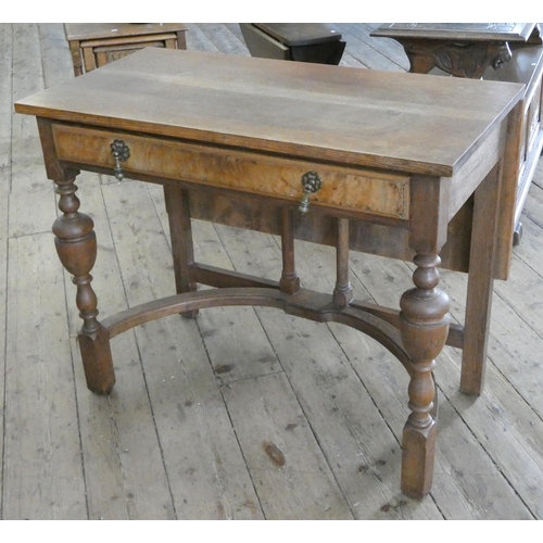 89 - An oak single flap drop leaf table, fitted drawer on stretcher style base, 3' wide