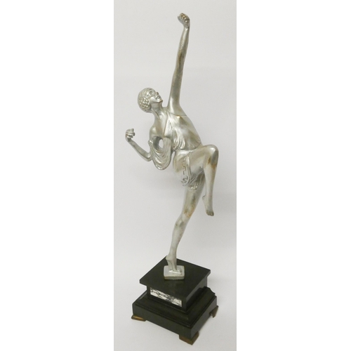 150 - An Art Deco silvered figurine of an exotic dancer standing on a square coloured onyx base, height ov... 