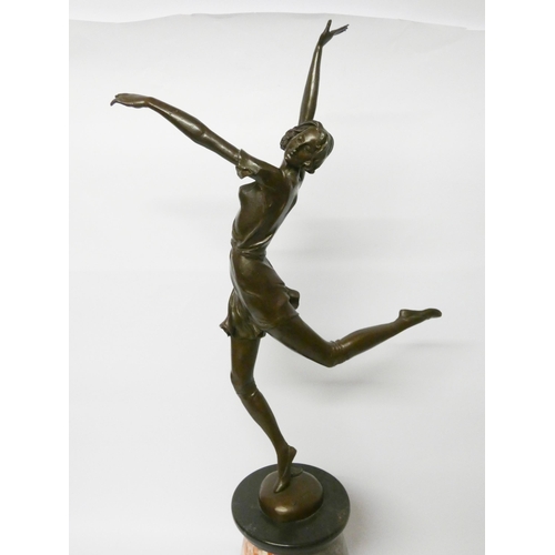 153 - A large Art Deco style figure in bronze of an exotic dancer standing on a tapering cylindrical base,... 