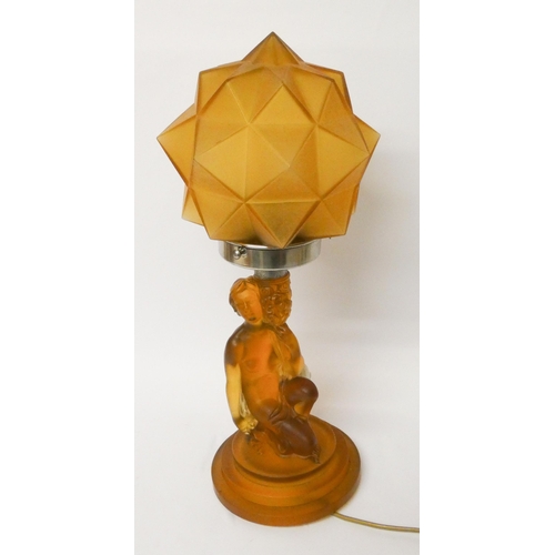 155 - Art Deco pressed amber glass table lamp modelled as a nude supporting a star shaped shade