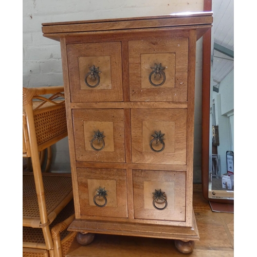 105 - A pair of matching Spanish style lamp tables or bedside tables each fitted six drawers