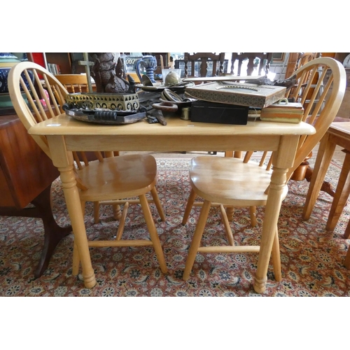 120 - A modern beech kitchen table and a pair hoop back Windsor dining chairs