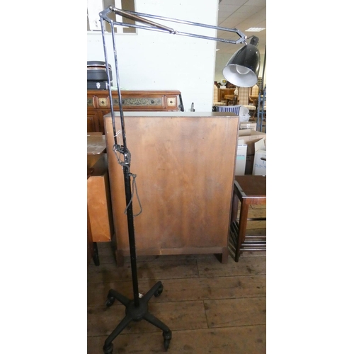 127 - A 1940's angle poise lamp on platform base with castors